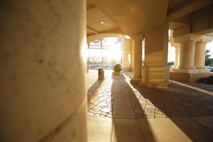 A large art installation on the CBU campus with a black sphere resting on a stone base