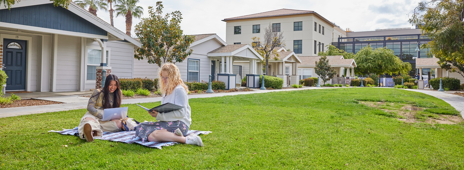 Students studying outside on the CBU lawn