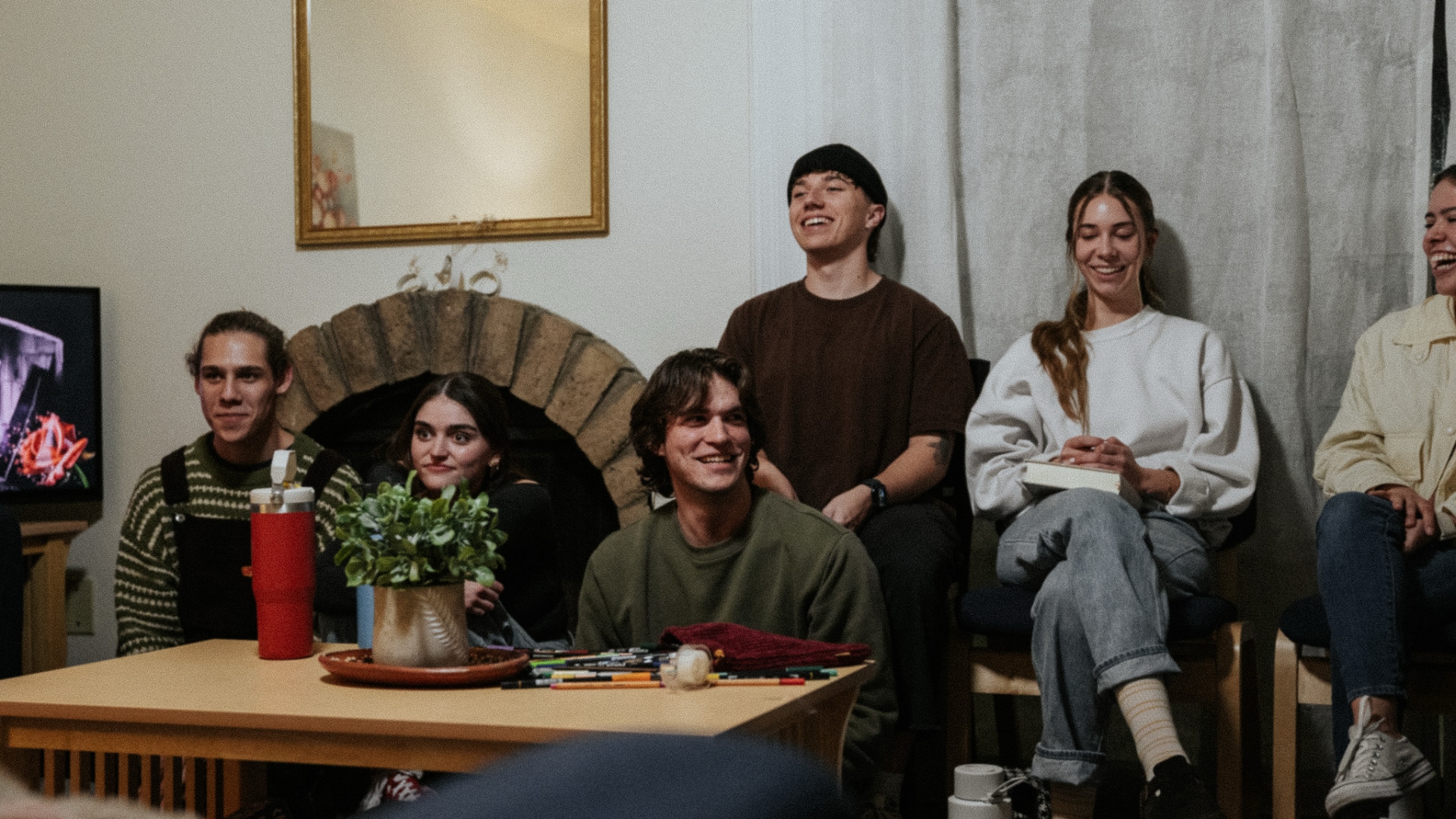 Bible Studies People sitting around a room with bibles