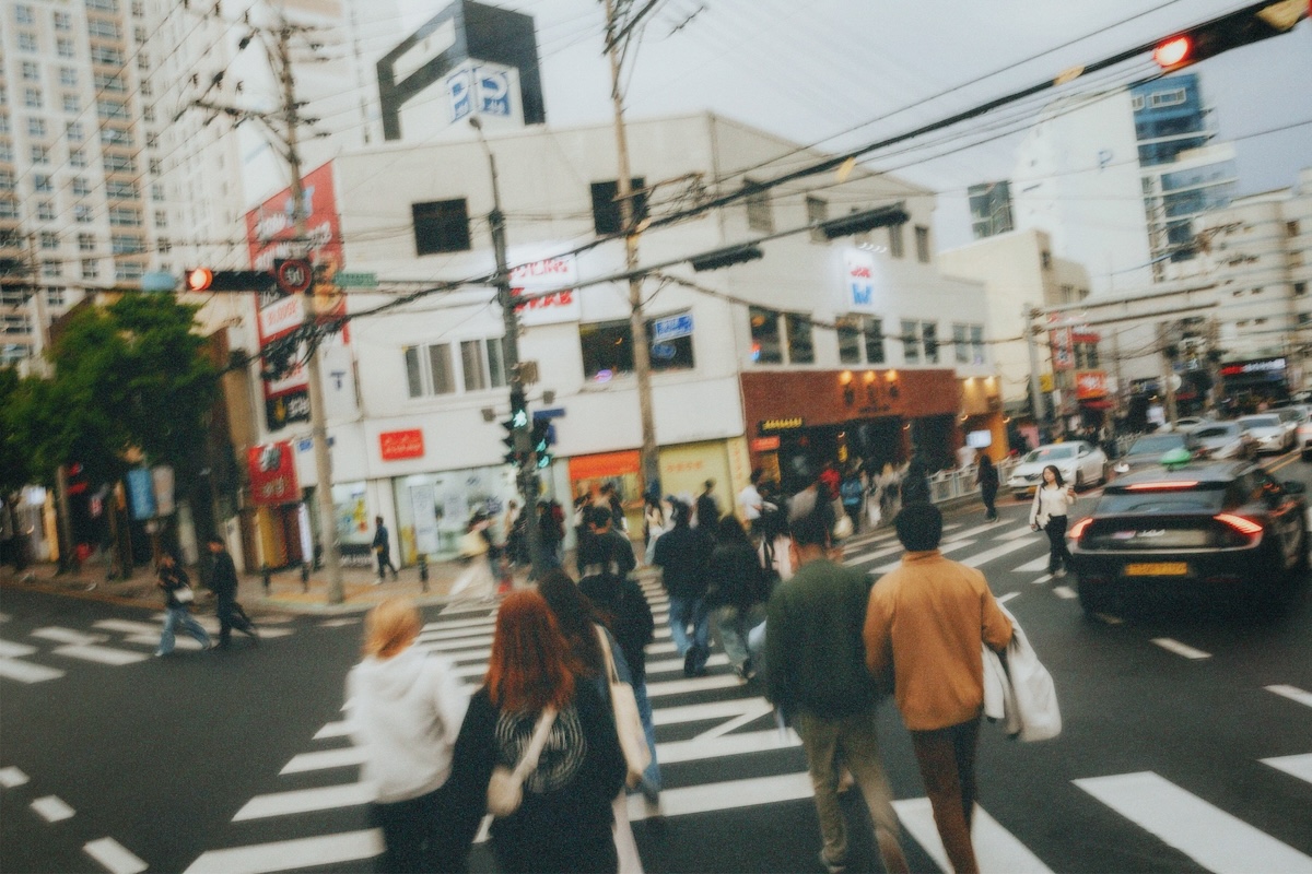 ISP Immersion people walking across busy street
