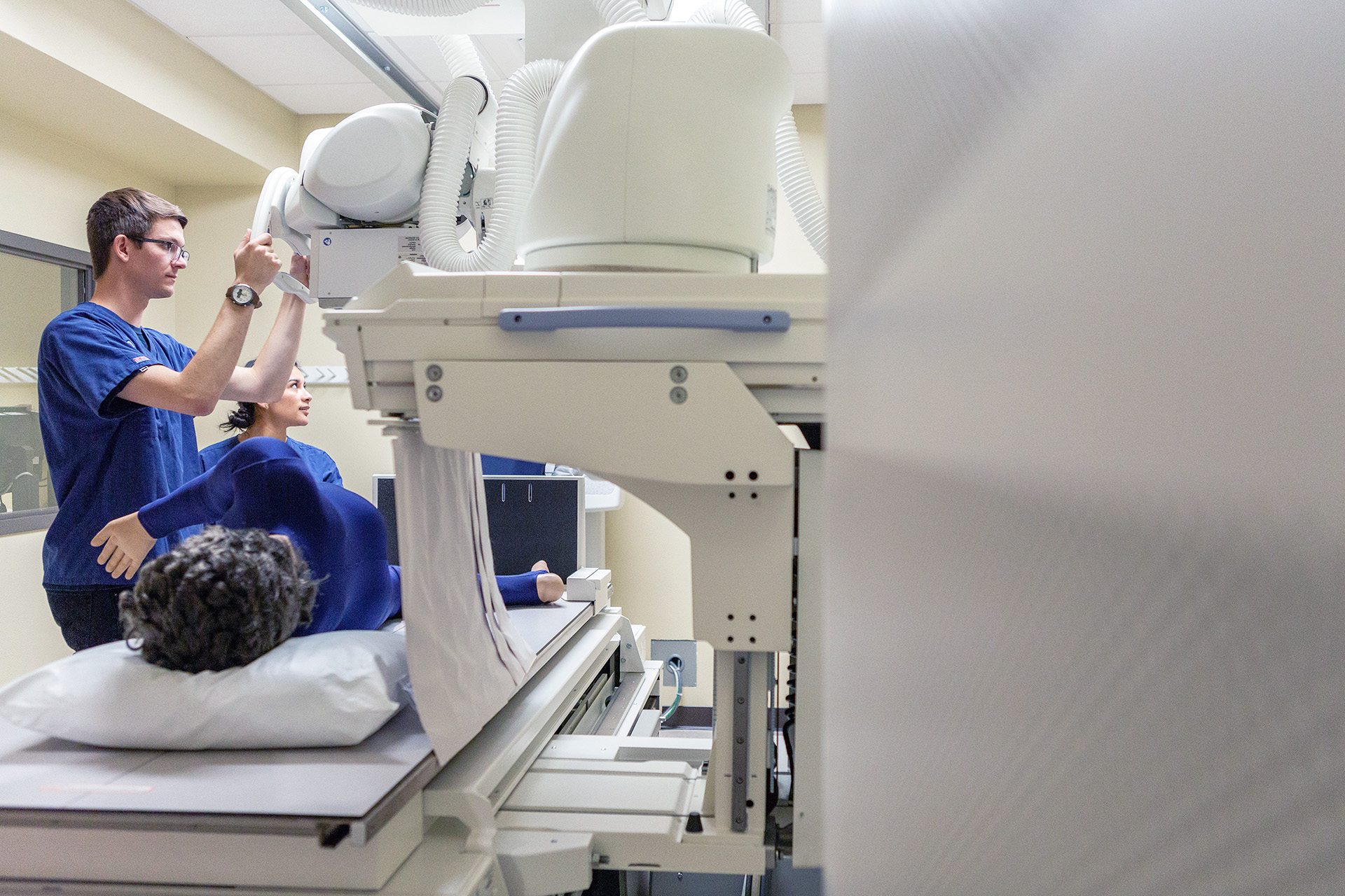 CBU Radiology Students Operating a Machine