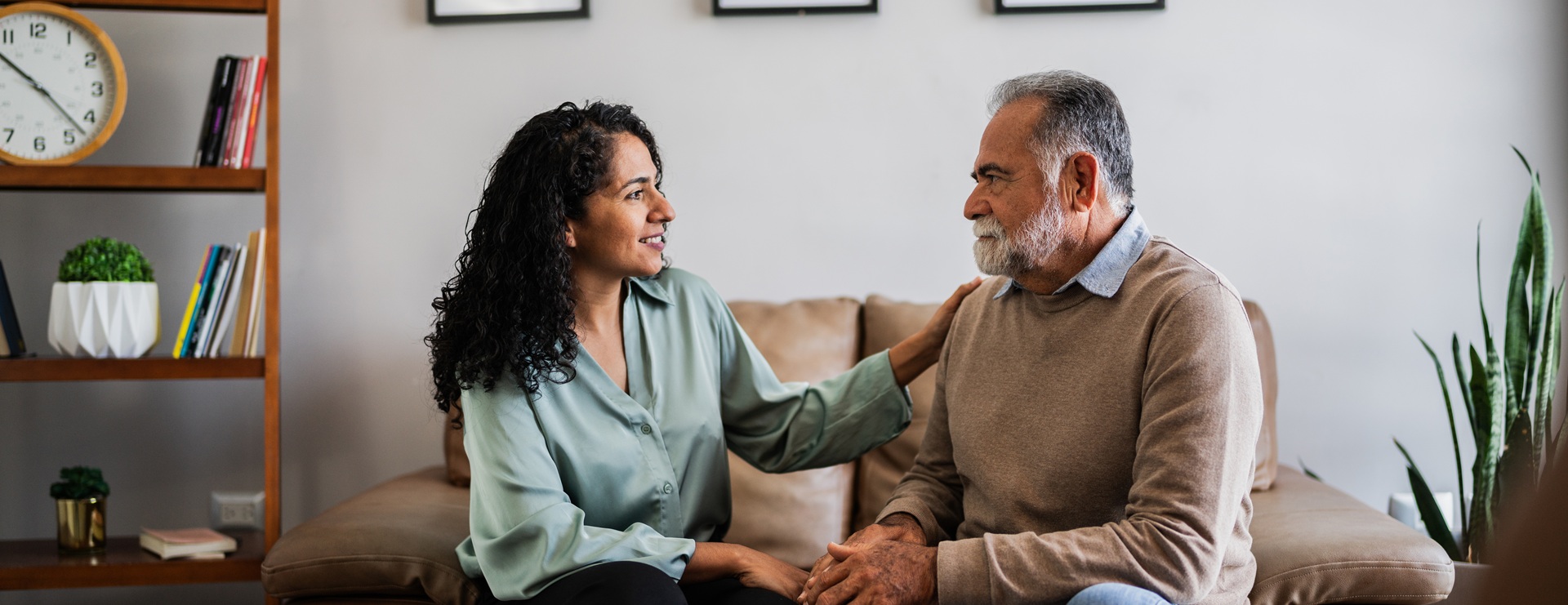 Therapist talking to and comforting a man