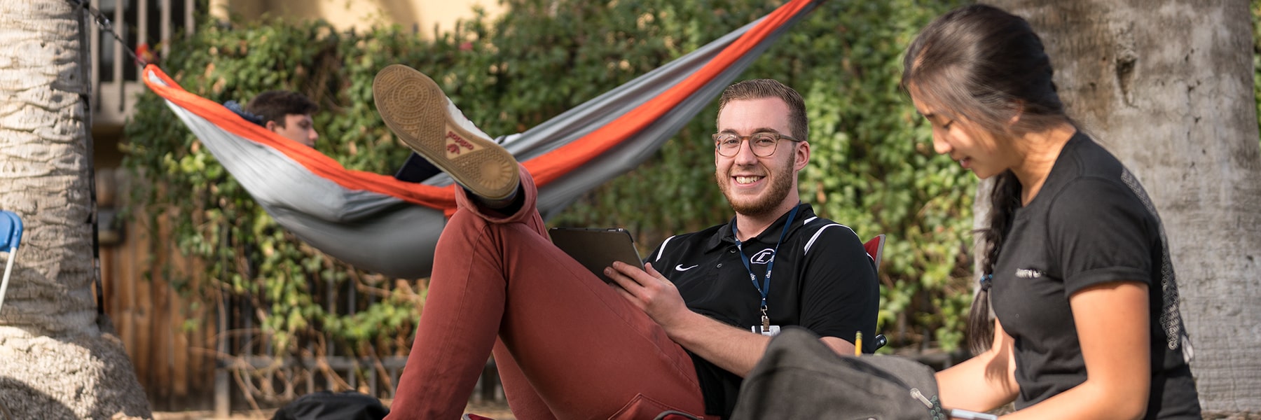 Two CBU students studying outside